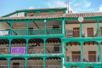 spanish plaza views, traditional rooftops, architectural details, essence of historic Chinchón...