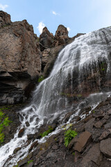 Beautiful photo with a mountain waterfall
