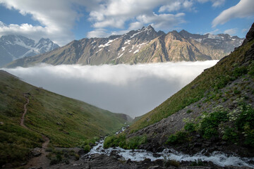 Beautiful mountain landscape with fog and river