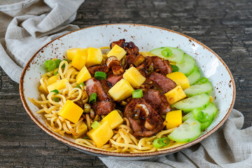 Hoisin duck with mango and egg noodles