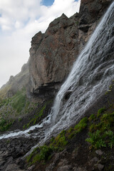 Beautiful photo with a mountain waterfall - 636720133