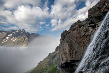 Beautiful photo with a mountain waterfall - 636720352