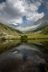 Fototapeta na wymiar Beautiful mountain landscape with lake and clouds