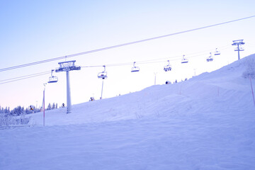 ski resort, toboggan run, funicular cabins go uphill, beautiful winter landscape, concept holiday...
