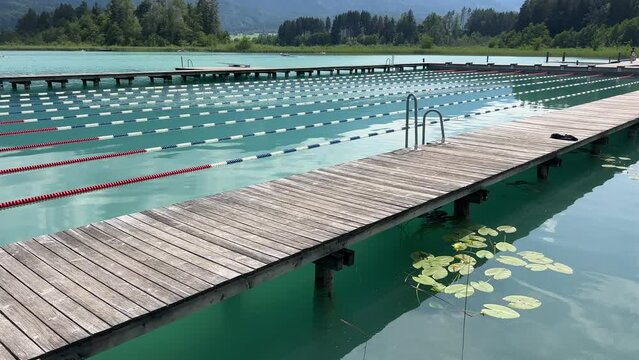 outdoor basin with swimming lanes in alpine lake Faaker See
