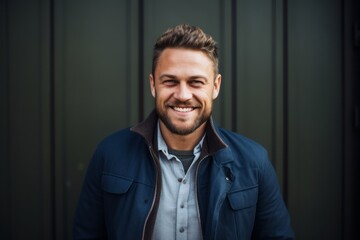 Group portrait of a Russian man in his 30s in an abstract background wearing a chic cardigan