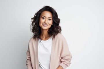Obraz premium Portrait of a beautiful young asian woman standing against white background