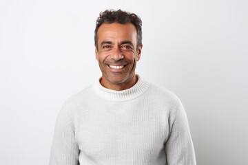 Portrait of a smiling middle-aged man in a white sweater