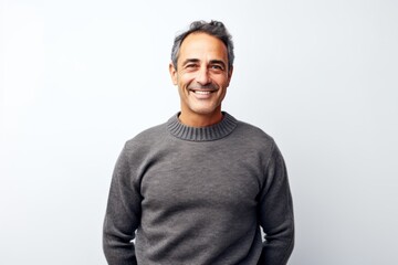Portrait of a middle-aged man smiling at the camera against white background