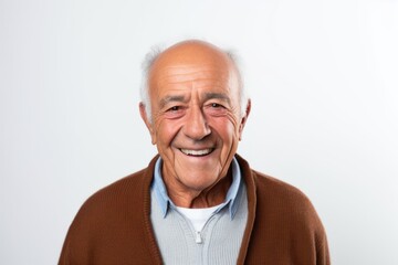 Obraz premium Portrait of happy senior man smiling at camera on white background.