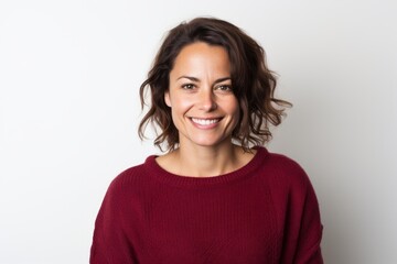 Fototapeta premium Portrait of a smiling woman in a red sweater on a white background