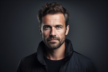 Obraz premium Portrait of a handsome man in a black jacket. Men's beauty, fashion.