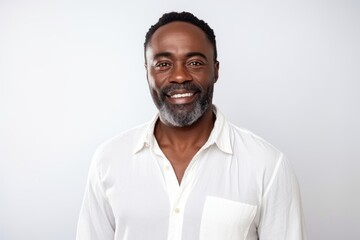 Medium shot portrait of a Nigerian man in his 40s in a white background wearing a chic cardigan