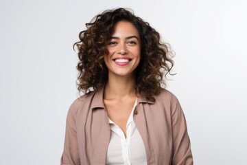 Portrait of a smiling businesswoman looking at camera over white background
