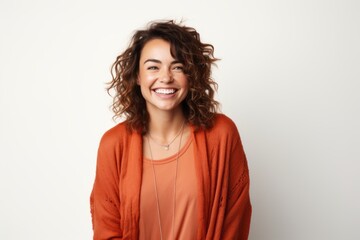 Fototapeta premium Portrait of a happy young woman smiling at camera over white background