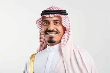 Medium shot portrait of a Saudi Arabian man in his 40s in a white background wearing a chic cardigan