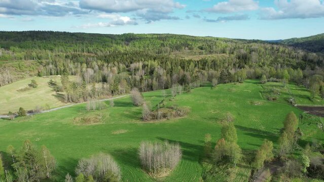 Aerial view of green hills and forests in Norway countryside