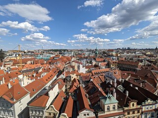 Naklejka na ściany i meble Panorama of the roofs of Prague from the Clock Tower, Czech Republic - August 2023