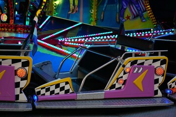 a carnival ride with a checkered theme on the ground