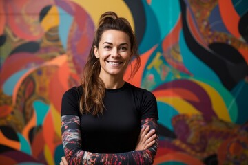 Portrait of a Russian woman in her 30s in an abstract background wearing a pair of leggings or tights
