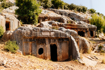 Naklejka premium Rock burials in Turkey. Mountain landscape with stone caves in which ancient burials