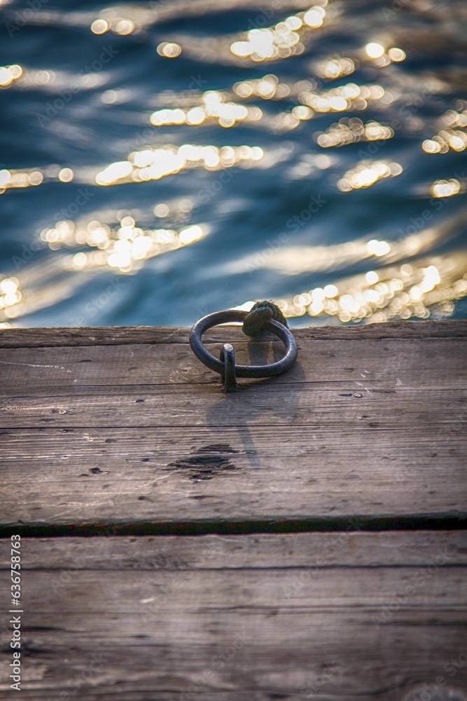 Sticker scenic wooden boardwalk with a metal ring for the mooring of boats