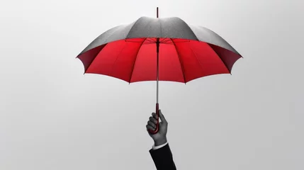 Fotobehang Businessman hand with an red umbrella isolated on gray created with Generative AI technology. © pvl0707
