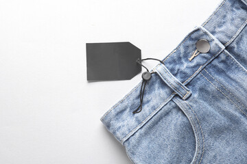 Sale, black friday. Blue jeans with black sale tag