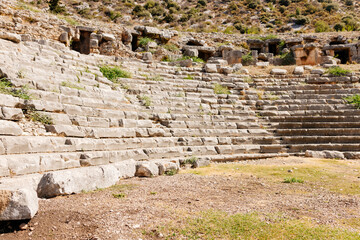 Old stone buildings of the ancient city. Amphitheater in the ancient city of Myra, T&uuml;rkiye. Ancient architecture in Turkey