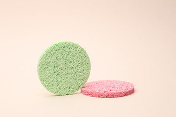 Make-up remover sponges on beige background