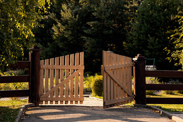 wooden gate of a wooden fence, taken on a summer day