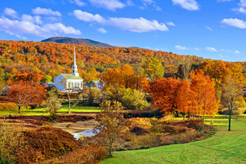 Autumn countryside view of the town of Stowe with white church and fall colors, Vermont, USA