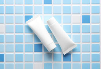 White Cream tubes on blue tiles. Beauty concept. Mockup for design. Top view