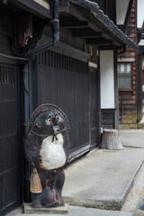 Racoon Dog at preserved post town of Narai juku, Kiso valley - obrazy, fototapety, plakaty