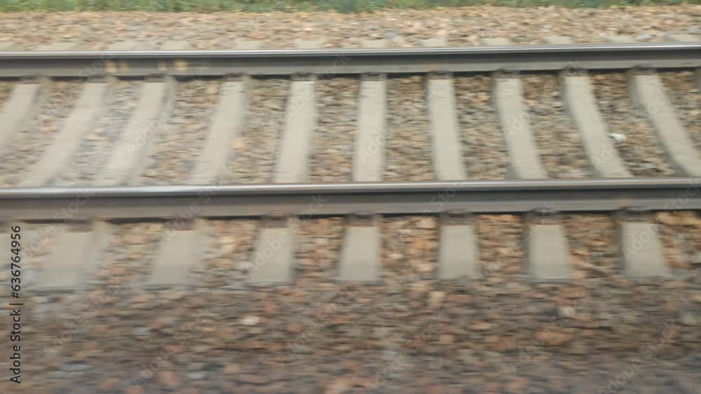Poster fast-moving railway outside train window.
