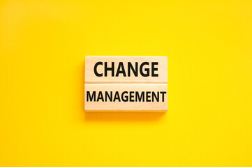 Change management symbol. Concept words Change management on beautiful wooden block. Beautiful yellow table yellow background. Business change management concept. Copy space.