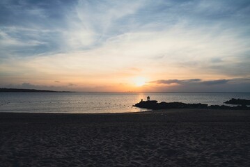 Beautiful shot of silhouettes on Long Island beach at sunset