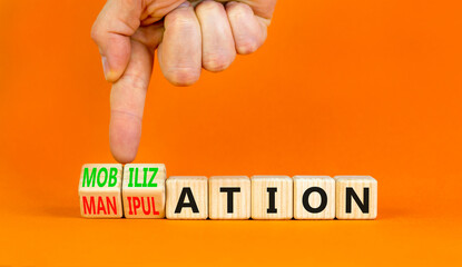 Mobilization or manipulation symbol. Concept words Mobilization Manipulation on wooden cubes....