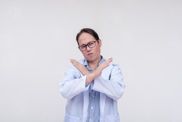 A family doctor shows his disapproval, making an x-mark with both hands. forbidding certain foods...