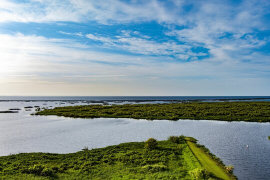 Aerial view of Lake Okeechobee surrounded by lush greenery in Florida, the United States