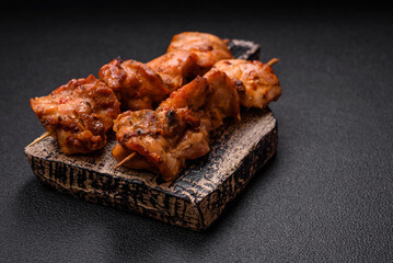 Delicious fresh, juicy chicken or pork kebab on skewers with salt and spices