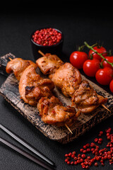 Delicious fresh, juicy chicken or pork kebab on skewers with salt and spices
