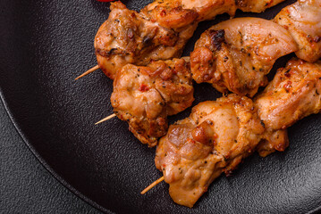 Delicious fresh, juicy chicken or pork kebab on skewers with salt and spices