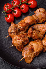 Delicious fresh, juicy chicken or pork kebab on skewers with salt and spices