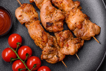 Delicious fresh, juicy chicken or pork kebab on skewers with salt and spices