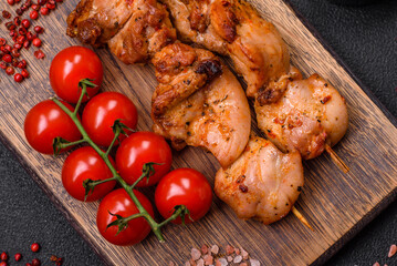 Delicious fresh, juicy chicken or pork kebab on skewers with salt and spices