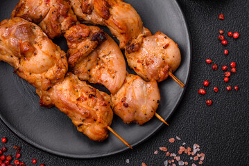 Delicious fresh, juicy chicken or pork kebab on skewers with salt and spices