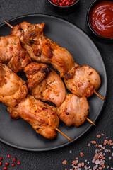 Delicious fresh, juicy chicken or pork kebab on skewers with salt and spices