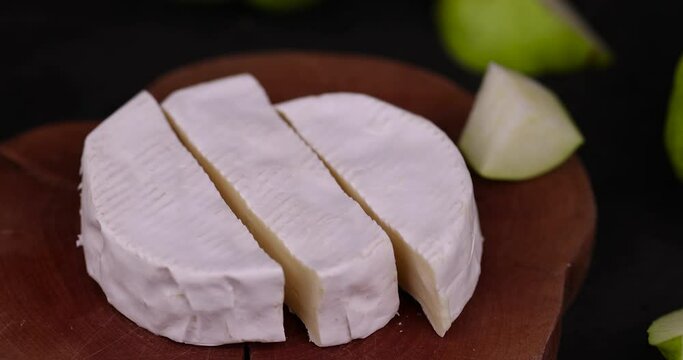 soft fresh hard cheese with white mold, delicious cheese covered with white edible mold