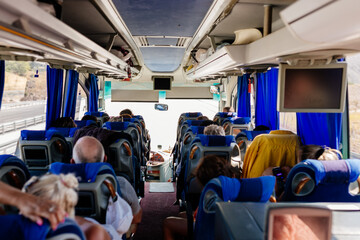 Many people travel in a comfortable large bus on a summer day. Ancient city of Pamukkale, Hierapolis, Türkiye - July 29, 2023